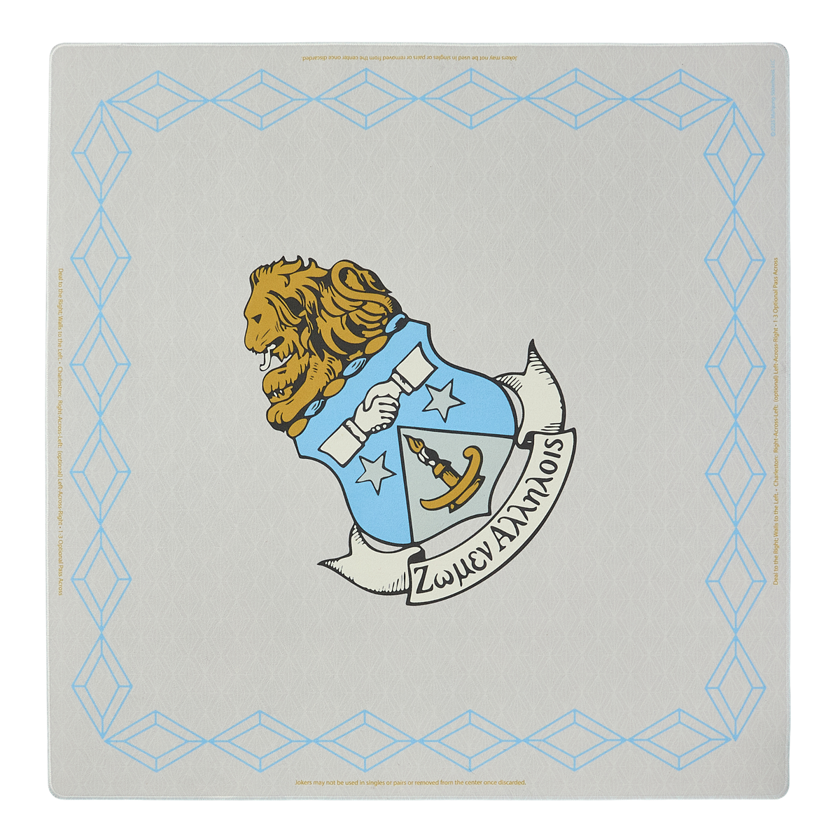 Decorative mahjong mat with a lion emblem and text on a sand background