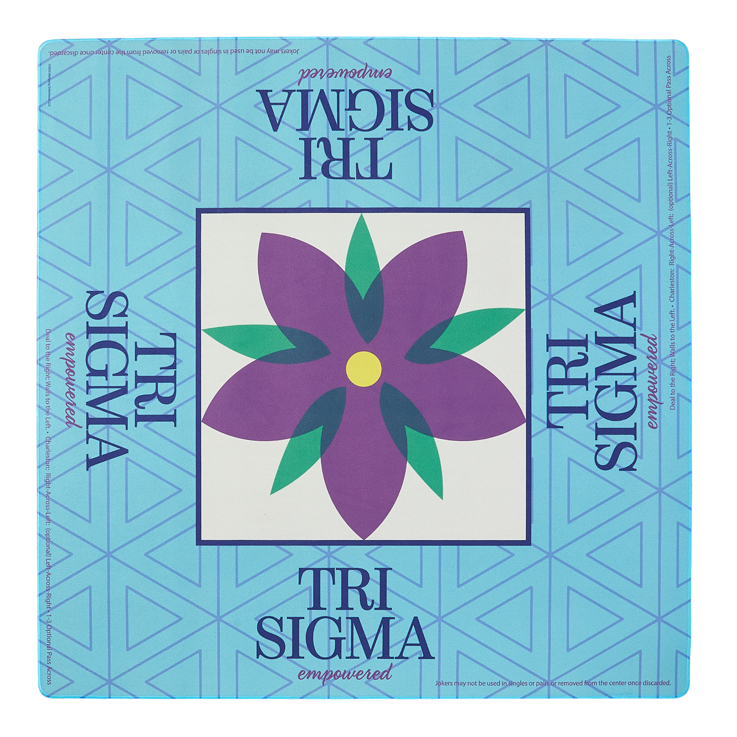 Tri Sigma mahjong mat with a purple flower design on a blue geometric patterned background